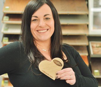 Dealer with a wood heart in her hand